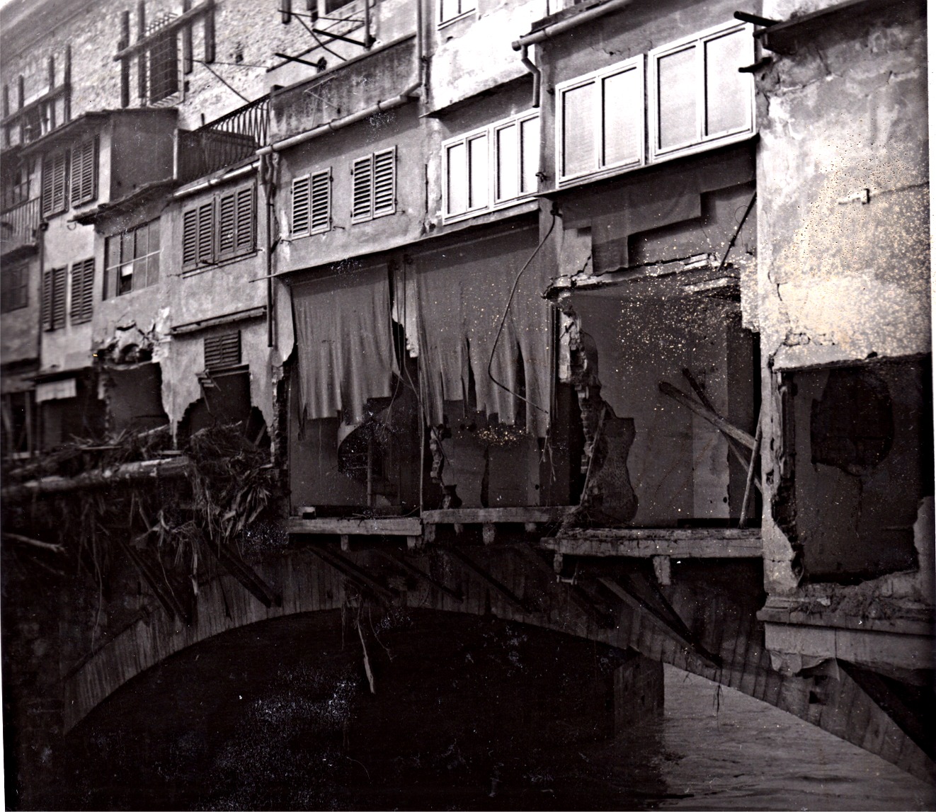 Photo of the Ponte Vecchio destruction after the 1966 Florence flood / photo courtesy of Ugo Gherardi for publication in The Florentine